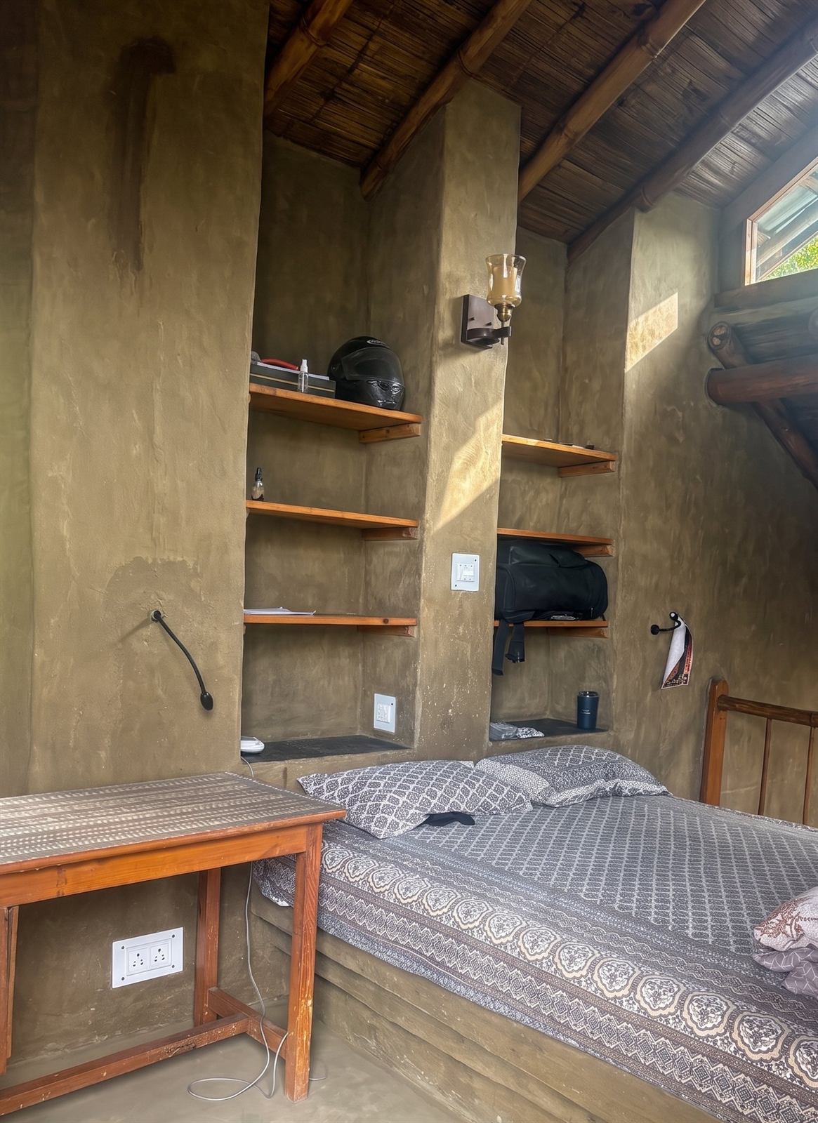A bed platform, shelves and niches sculpted directly into earthen walls